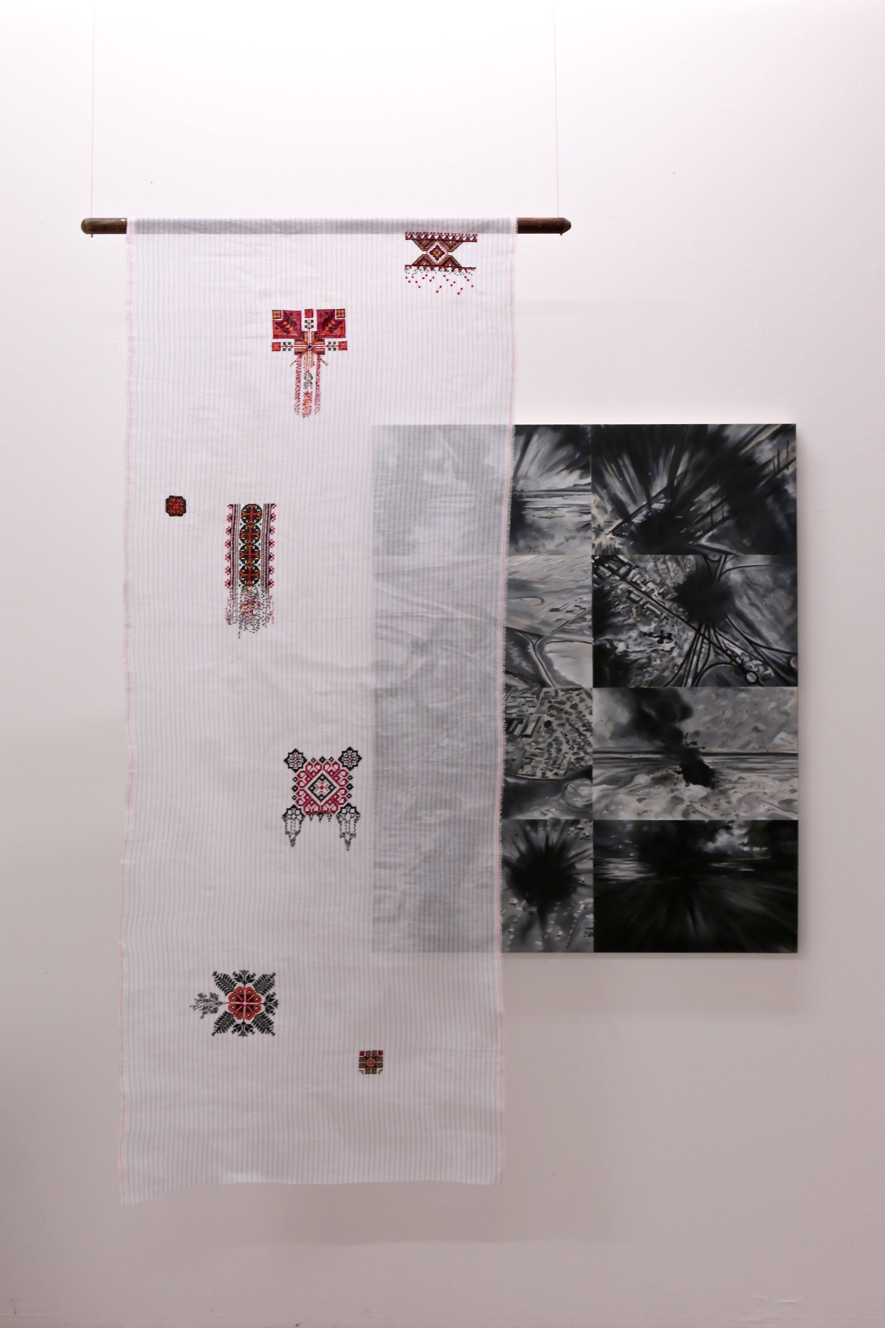 An installation with paintings, textiles and ladders is shown as a physical collage. The space they sit within is white and lit from above.