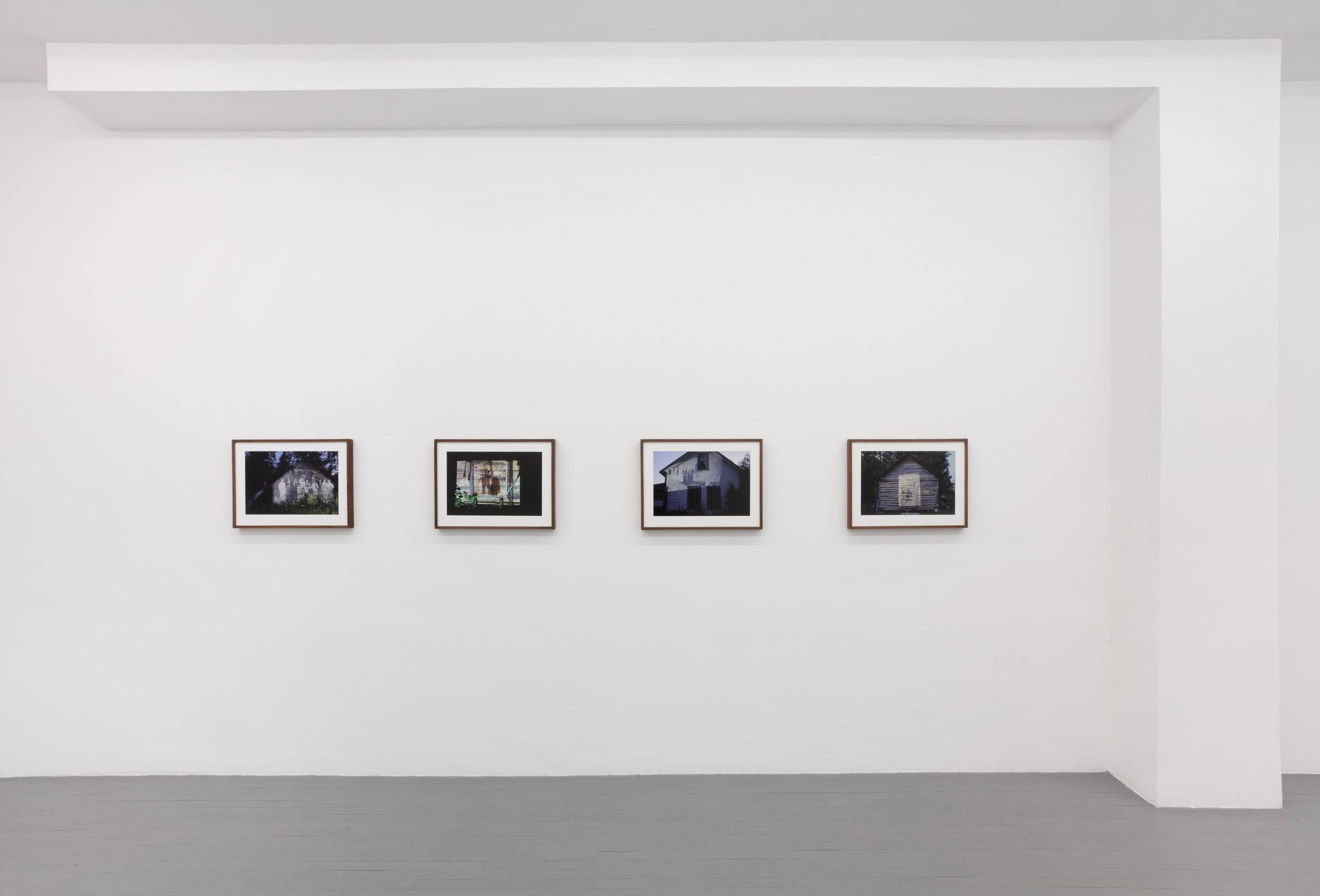 A Carpathian region Ukrainian dance costume is compressed beneath a sheet of glass.
