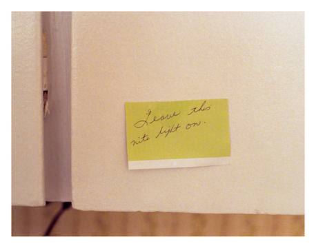 A collaged oil painting, the images are oriented in varying directions. It depicts a set of hands clasping red spotted flowers, a single lit white candle, a woman looking out onto a highway through veiled transparent curatins and a young girl at the table while her mother works in the kitcen behind her.